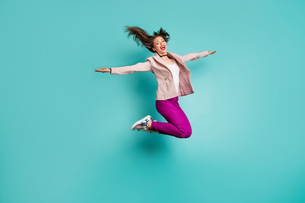 Full length body size view of girl jumping having fun flying