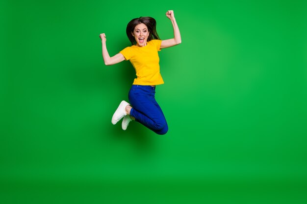 Photo full length body size view of glad cheerful girl jumping