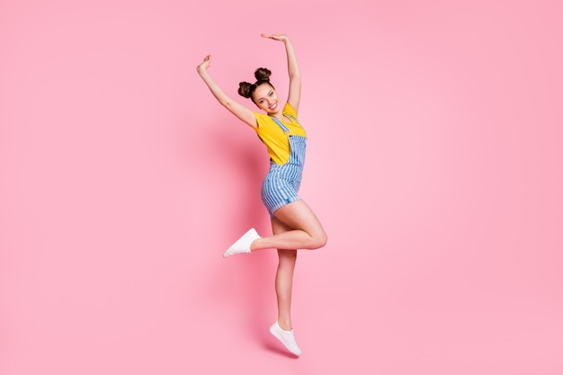 full length body size view of graceful fit cheerful girl jumping rising hands