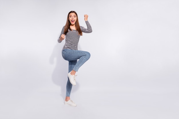 Full length body size view of her she nice attractive charming cheerful cheery ecstatic straight-haired girl having fun lottery winning holiday vacation good news isolated over white light wall