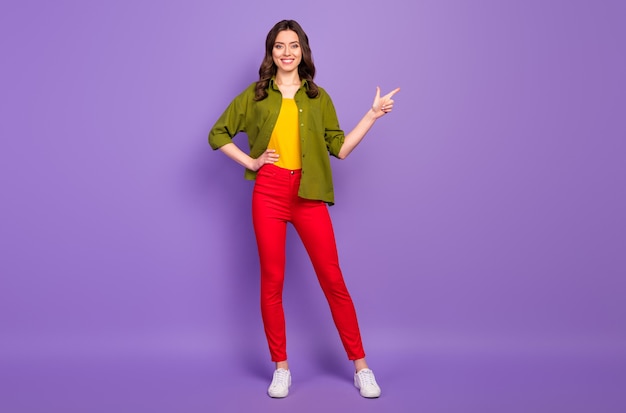 Full length body size view of her she nice attractive confident cheerful wavy-haired girl demonstrating copy space ad advert isolated on bright vivid shine vibrant lilac violet purple color background