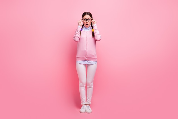 Full length body size view of her she nice attractive lovely pretty smart clever amazed stunned girl geek wearing touching specs information reaction isolated over pink pastel color background