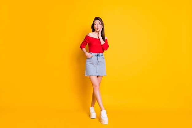 Full length body size view of her she nice attractive lovely slender girlish cheery dreamy girl pout lips thinking isolated over bright vivid shine vibrant yellow color background