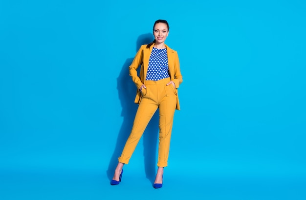 Full length body size view of her she nice-looking well-dressed attractive charming classy cheerful lady partner leader holding hand in pocket isolated bright vivid shine vibrant blue color background