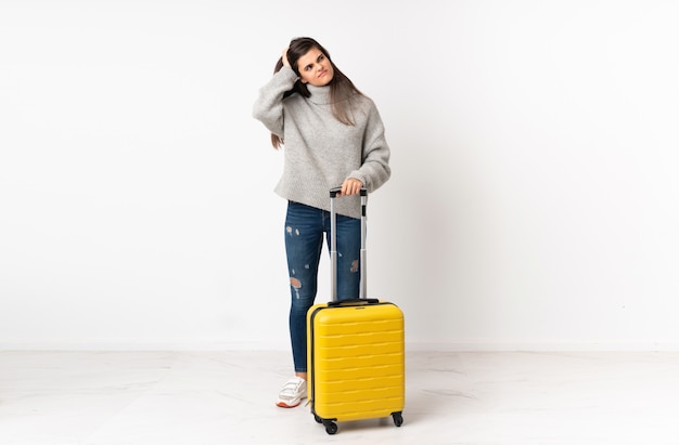 A full length body of a traveler woman with a suitcase