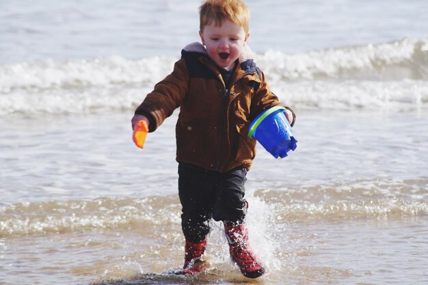 Full length of boy on beach