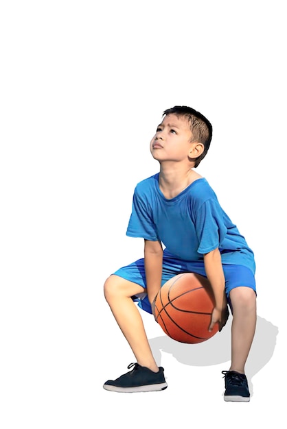 full length of boy playing with basketball against white background