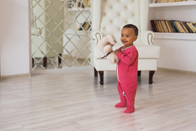 Photo full length of boy standing on floor at home