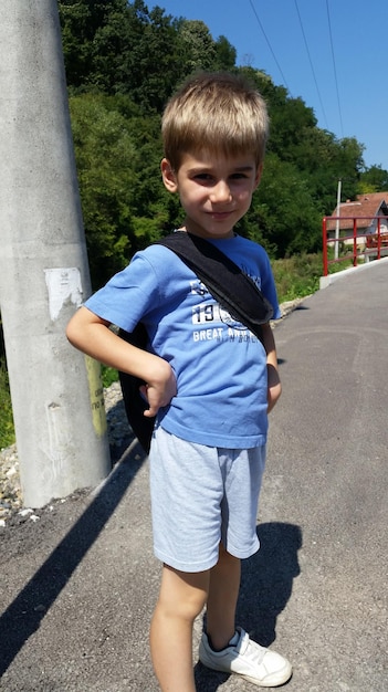 Photo full length of boy standing outdoors