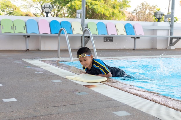 Full length of boy in swimming pool