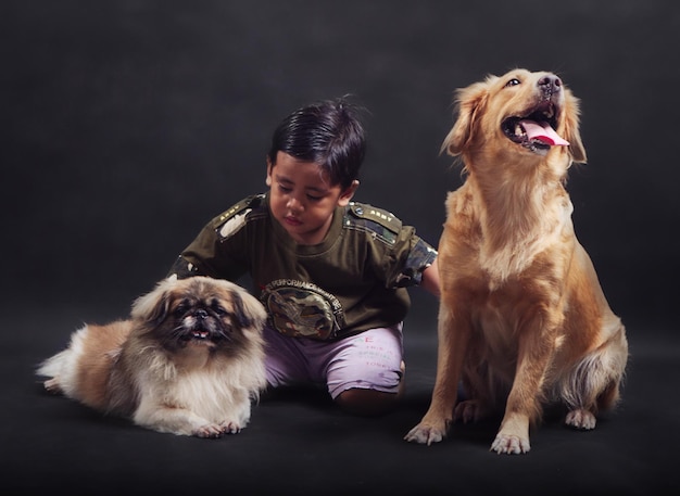 Photo full length of dog sitting against black background