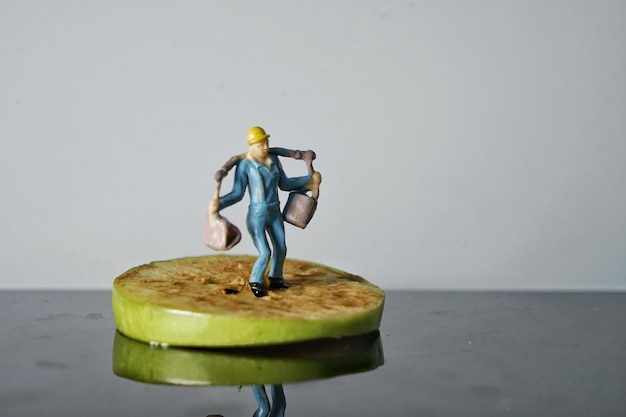 Photo full length of figurine on table against white background