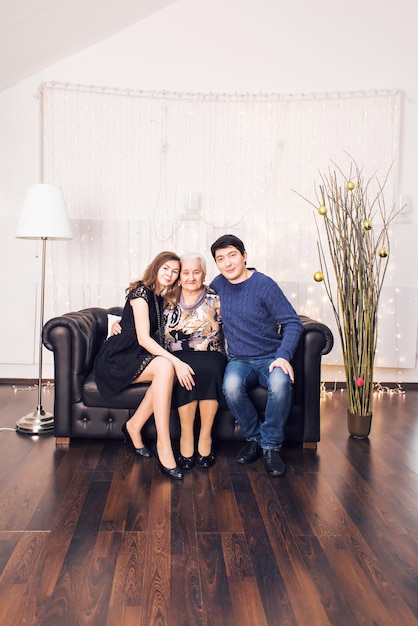 Full length of friends sitting on wooden floor