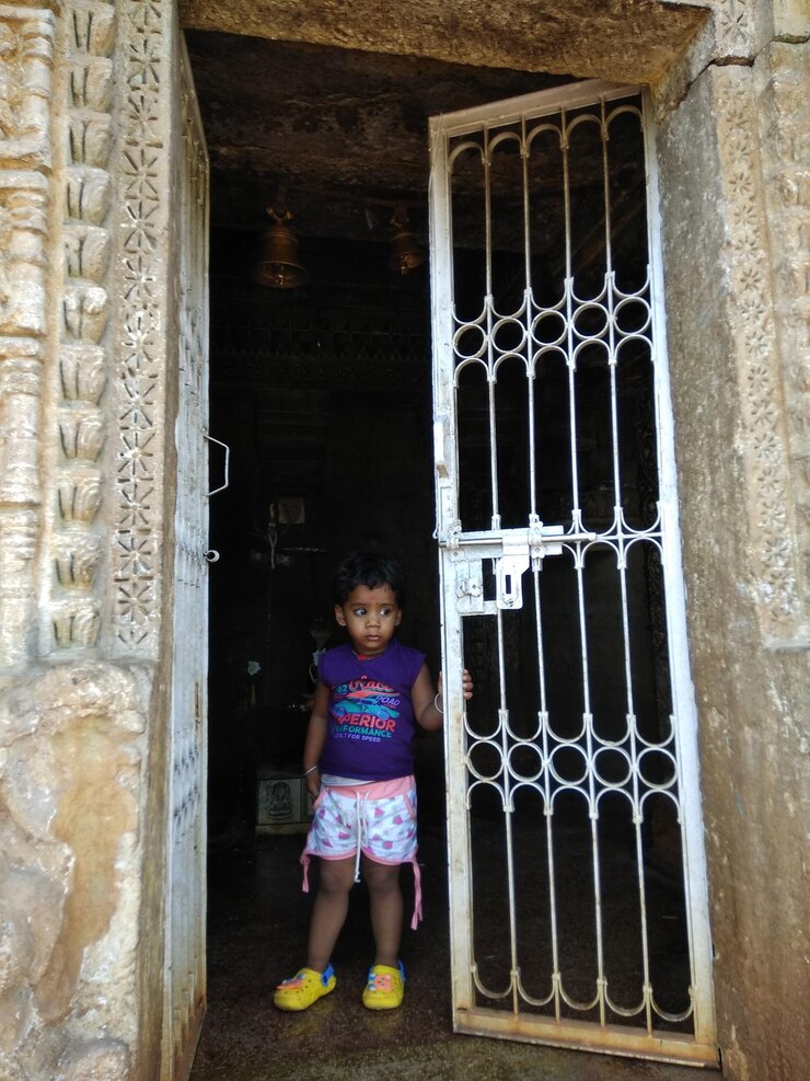 फोटो full length of girl standing by metal gate