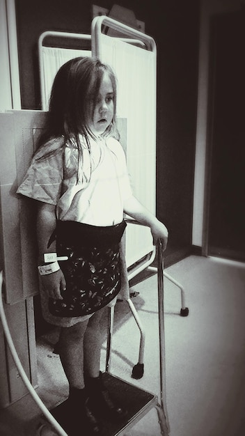 Full length of girl standing at hospital