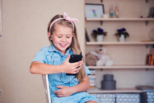 Full length of girl using mobile phone