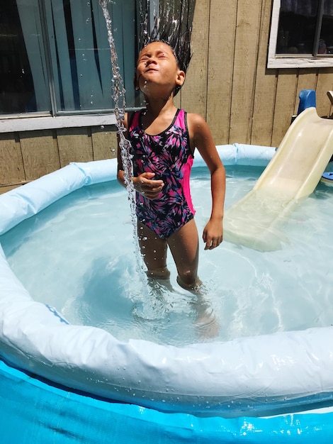 Full length of girl in wading pool