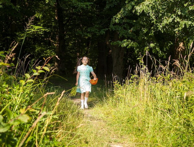 Full length of girl walking in forest