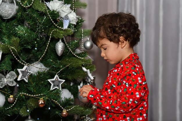 Full length of girl with christmas tree