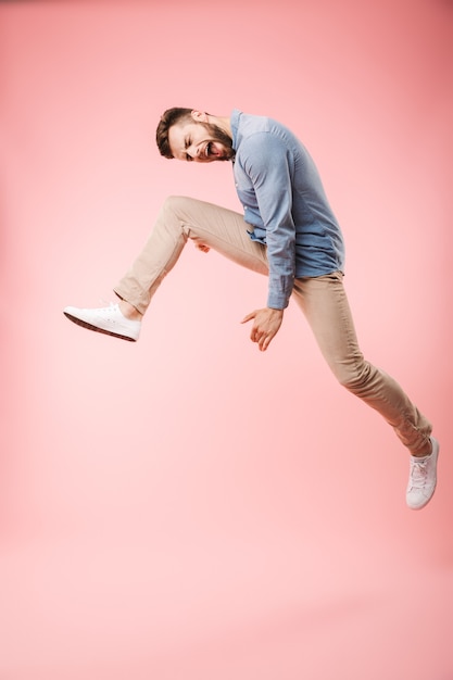 Full length of a happy young man jumping