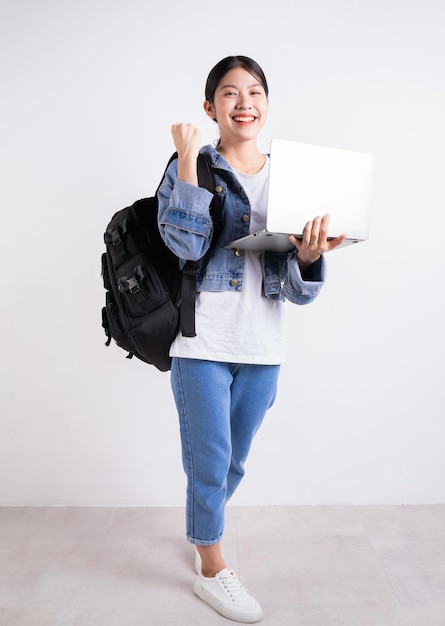 Full length image of young Asian student