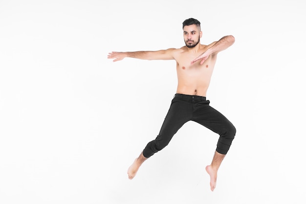 Full length of man  ballet dancer leaping in mid air isolated on white