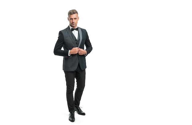 Full length of man in bow tie suit. businessman isolated on white. formal wear concept.
