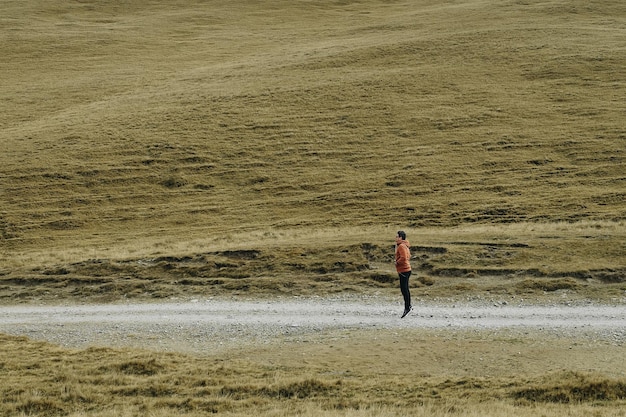 Full length of man jumping on landscape