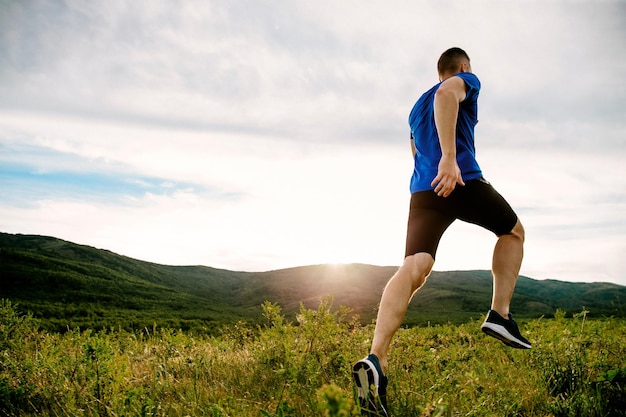 Full length of man running on field against sky