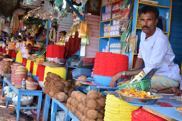 Full length of man for sale at market stall