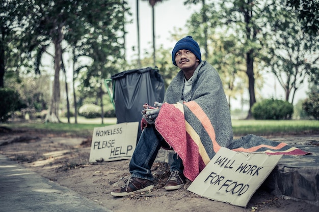 Full length of man sitting on road