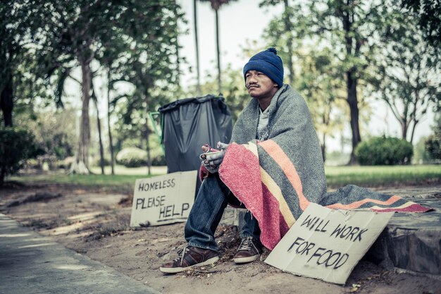 Full length of man sitting on road