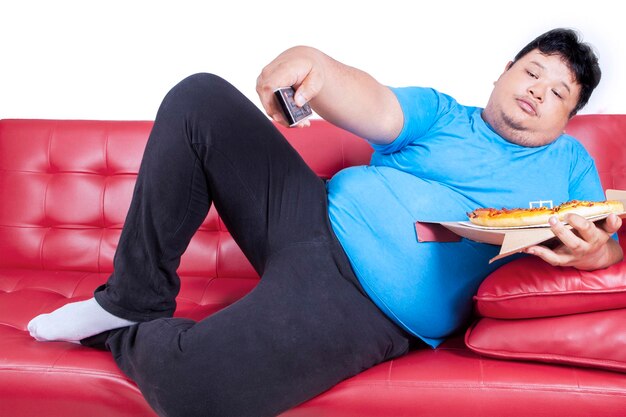 Photo full length of man sitting on sofa