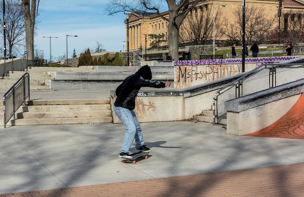 Full length of man skateboarding at park