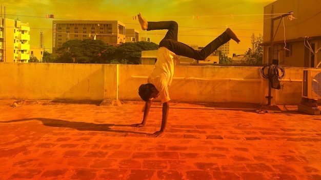 Full length of man skateboarding on wall against sky