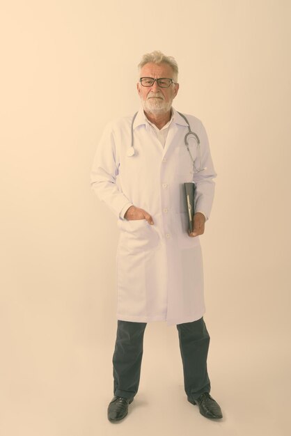 Full length of man standing against white background