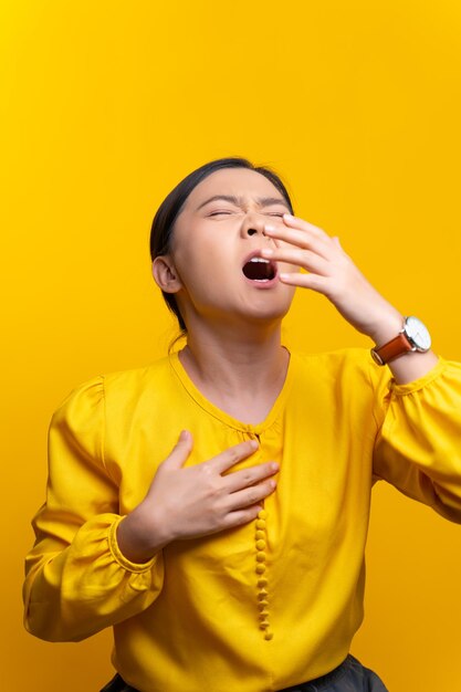 Full length of man standing against yellow wall