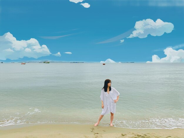 Full length of man standing on beach against sky