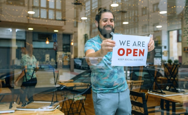 Photo full length of a man standing at store