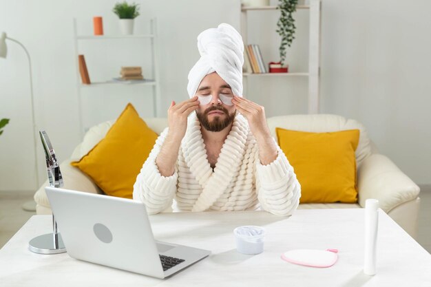 Full length of man using mobile phone at home