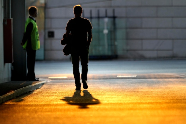 Photo full length of man walking on road