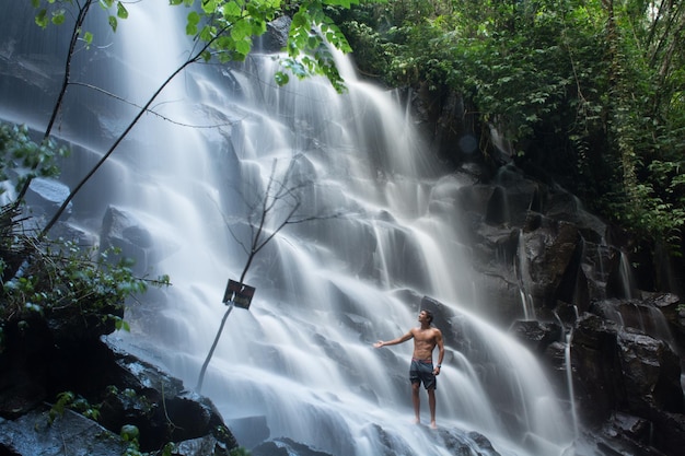 full length of man at waterfall