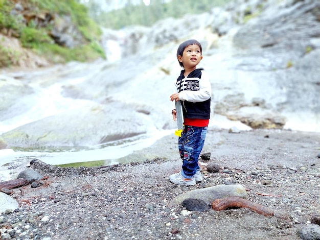 Full length of my boy on the rock