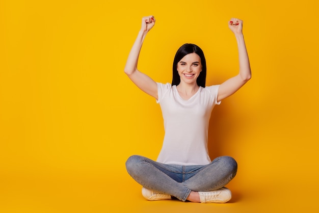 Full length photo of crazy funky girl celebrate victory raise fists scream yeah isolated over vivid color background