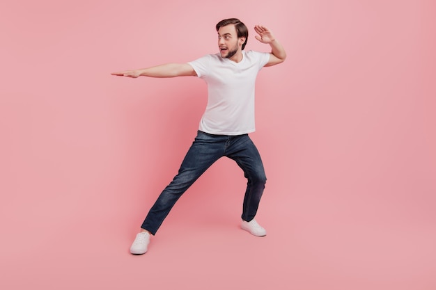 Full length photo of handsome attractive guy karate training sportive isolated pink color background