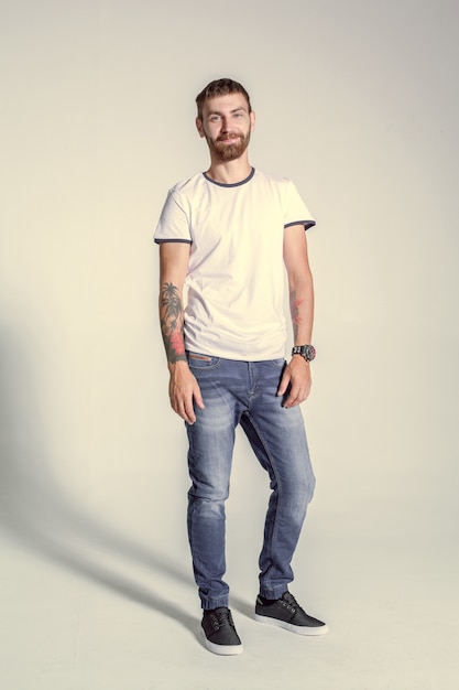 Full length picture of a casual young man posing