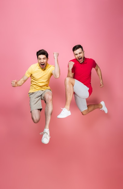 Full length portrait of a cheerful friends celebrating