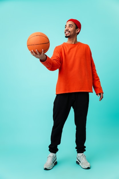 Full length portrait of a cheerful young afro american man