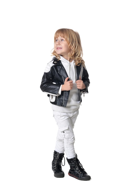 Full length portrait of cute little boy in black leather jacket isolated on white background