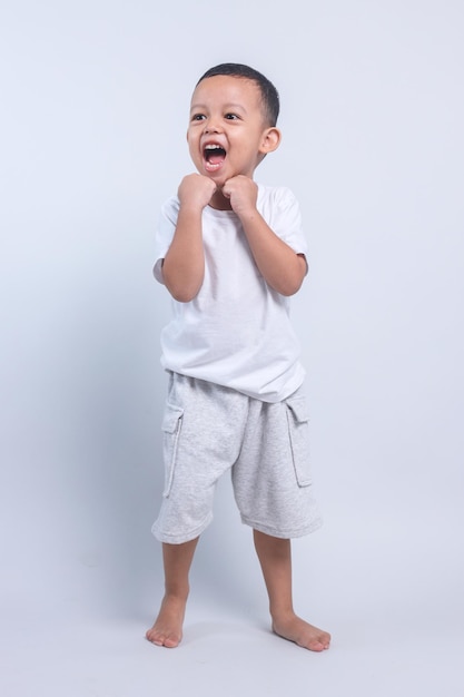 Full Length Portrait of Excited Baby Boy Isolated Gray Background